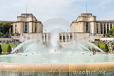 Tourists swimming at the fountain in front of the Palais de Chaillot, a building at the top of the Chaillot hill in the Trocadero Editorial Stock Photo