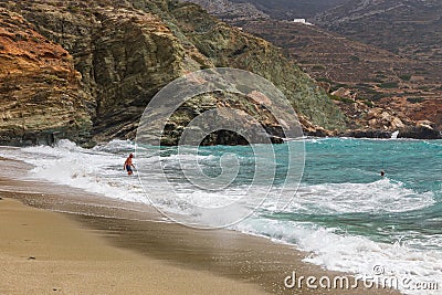 Tourists swimming in the sea, Agkali Beach, Folegandros Island, Greece Editorial Stock Photo