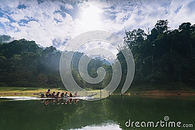 Tourists take a boat to see the scenery of the forest, wildlife and Bang Lang reservoir. Editorial Stock Photo