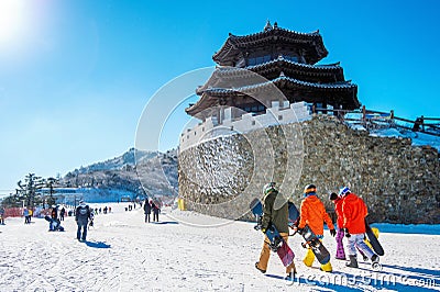 Tourists taking photos of the beautiful scenery and skiing. Editorial Stock Photo