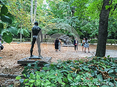 Tourists taking photos on the grounds of the Rodin Museum, Paris Editorial Stock Photo