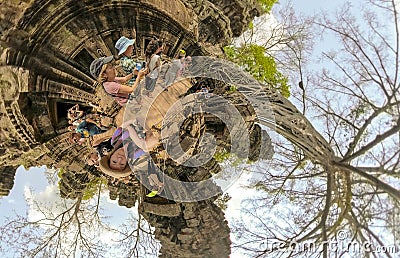 Tourists taking selfies in Ta Prahm, Cambodia Editorial Stock Photo