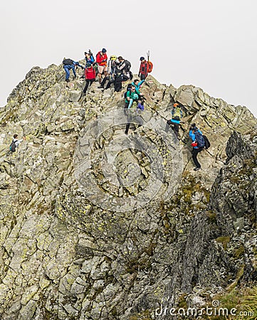 Tourists on their way to the popular Rysy peak. Tatra Mountains. Editorial Stock Photo