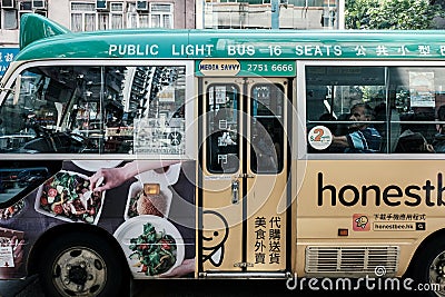 Tourists travel by the public light bus or Green minibus Editorial Stock Photo