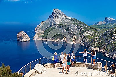 Tourists at vantage point with view Mirador Es Colomer on punta nau at cap formentor majorca mallorca. Balearic islands country of Stock Photo