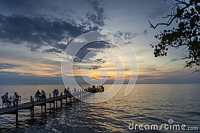 Tourists view sunset by pier in kep town cambodia coast Editorial Stock Photo