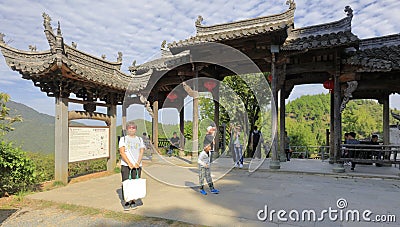 Tourists visit ancient decorated archway of anhui style, adobe rgb Editorial Stock Photo