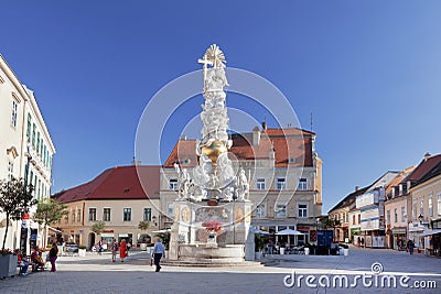 Tourists visit the Plague Column in Baden, Austria. Editorial Stock Photo