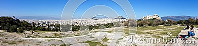 Tourists visiting the Acropolis and Athens city panorama Stock Photo