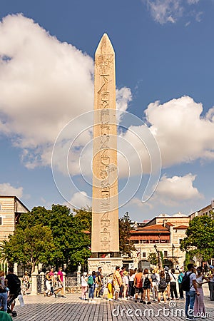 Tourists visiting ancient Egyptian Obelisk of Pharaoh Thutmose III, or Sultanahmet Square, Istanbul, Turkey Editorial Stock Photo