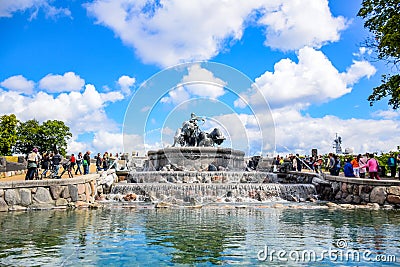 Tourists visiting Gefion Fountain, a group of animal figures being driven by the Norse goddess Gefjon, Copenhagen, Denmark Editorial Stock Photo