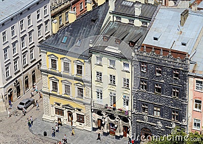 Tourists visiting Lviv market square with famous landmark - Black House,Ukraine Editorial Stock Photo