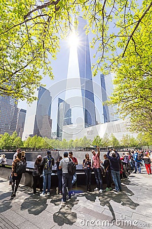 Tourists visiting 9 11 memorial park in downtown Manhattan, located on the site as the original World Trade Center. Editorial Stock Photo