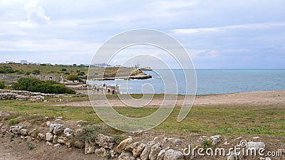 Tourists visiting the ruins of the ancient city of Chersonese. Tourists visiting the ruins of the ancient city of Chersonesos near the sea stock video Tourists visiting the ruins of the ancient city of Chersonese. Tourists visiting the ruins of the ancient city of Chersonesos near the sea stock video