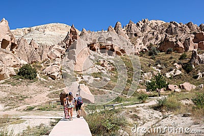 Tourists visiting zelve open air museum, archaeological site in cappadocia Stock Photo