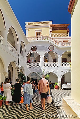 Tourists and visitors inside Panormitis monastery Editorial Stock Photo