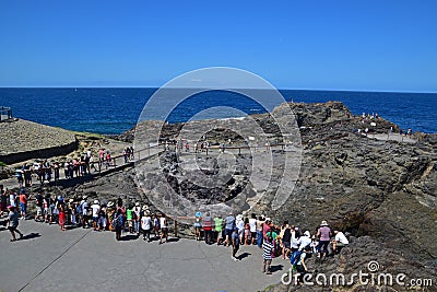 Tourists waiting patiently at Kiama Blowhole for the water to spray up Editorial Stock Photo
