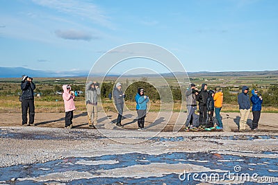 Tourists waiting to see geyser Strokkur erupt Editorial Stock Photo