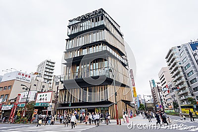 Tourists walk around Asakusa Culture Tourist Center in Asakusa district, Tokyo, Japan. made by Kengo Kuma Editorial Stock Photo