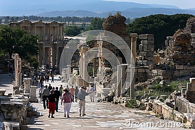 Tourists walk down Curetes Way at the ancient site of Ephesus in Turkey. Editorial Stock Photo