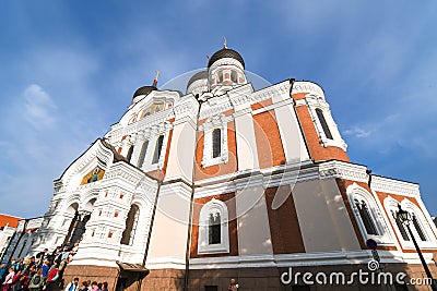 Tourists walk past the Alexander Nevsky Church in the medieval upper town of Toompea Hill in Tallinn Estonia Editorial Stock Photo