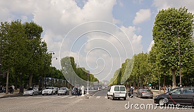 Tourists are walking along the Champs Elysees, vehicles are moving Editorial Stock Photo