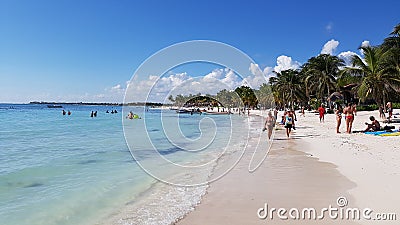 Tourists walking on the beach Editorial Stock Photo