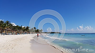 Tourists walking on the beach in Mexico, Riviera Maya Editorial Stock Photo