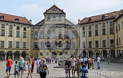 Tourists walking in courtyard of medieval palace and castle complex in Nesvizh, Belarus Editorial Stock Photo