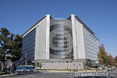 Tourists walking in front of the Osaka Prefectural Police Headqu Editorial Stock Photo