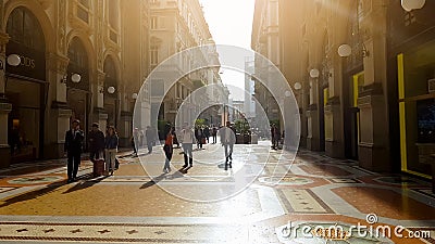 Tourists walking in Milan shopping center at sunny day, Italian architecture Editorial Stock Photo