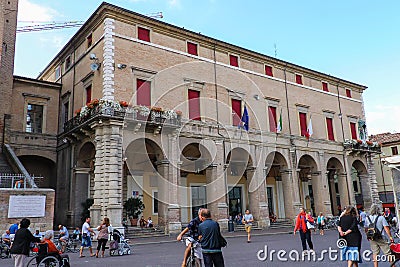 Tourists walking near Rimini City Hall on Cavour square Editorial Stock Photo