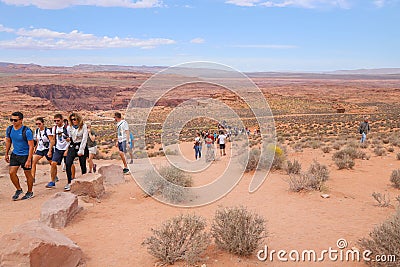 Tourists walking to the iconic Horseshoe Bent on the Colorado River Editorial Stock Photo