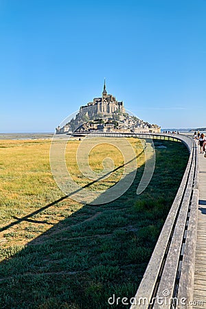 Tourists walking to Mont Saint Michel Normandy France Editorial Stock Photo