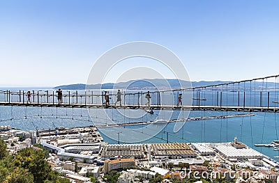 Tourists walking on Windsor suspension bridge Gibraltar Editorial Stock Photo