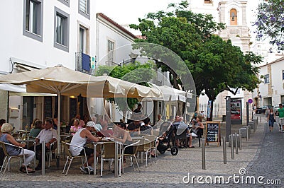 Touristy street in the historic center of Lagos in Portugal Editorial Stock Photo