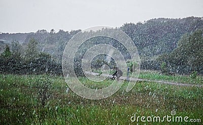 Cyclist in the rain Stock Photo