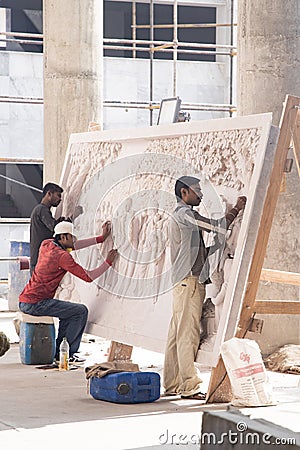 TOVP, Mayapur. West Bengal, India. - Dec 16, 2019. artisan working on sculpture on the building of the Temple of the Editorial Stock Photo