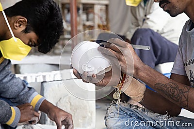 TOVP, Mayapur. West Bengal, India. - Dec 16, 2019. artisan working on sculpture on the building of the Temple of the Editorial Stock Photo