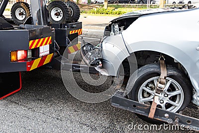 Tow truck towing broken down car from accident Stock Photo