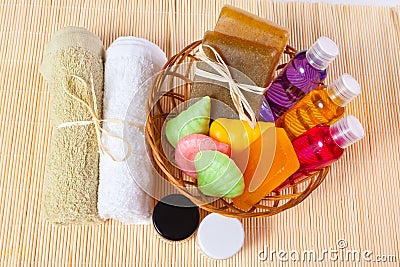 Towels and a basket of cosmetics Stock Photo