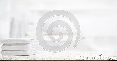 Towels on marble table in bathroom. Stock Photo