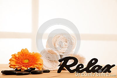 Towels and masage rocks on table in spa salon Stock Photo