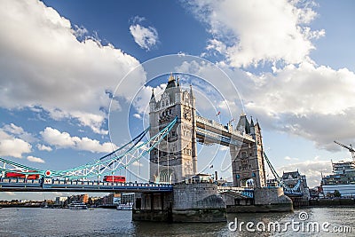 Tower Bridge. Famous London landmark. Red bus crossing the Thames Stock Photo