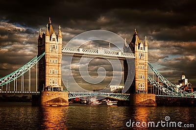 Tower Bridge in London, the UK. Dramatic stormy and rainy clouds Stock Photo