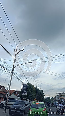 Tower, cara, Motorcycle, cloud, tower electric, cable, Houses, tree Editorial Stock Photo