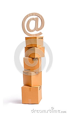 A tower of cardboard boxes and an email symbol on top. The concept of online sales, shopping and online shopping. Realization Stock Photo