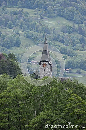 Catholic church behind the forest in Balzers in Liechtenstein 30.4.2020 Stock Photo