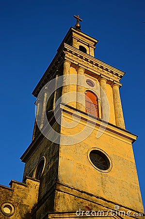 Tower of classicistic German evengelic church in Modra with typical square shape and columns, sunbathing in spring sunshine. Stock Photo