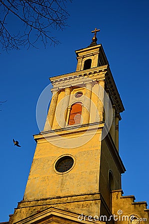 Tower of classicistic German evengelic church in Modra with typical square shape and columns, sunbathing in spring sunshine. Stock Photo